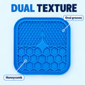 Dual-texture lick mat with oval grooves and honeycomb pattern