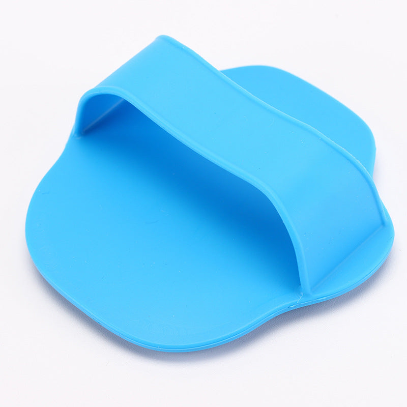 Hand strap on the back of the bath brush in dog grooming set
