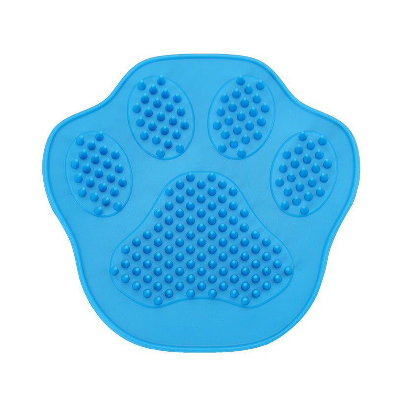Paw-shaped bath brush with bristles in dog grooming set